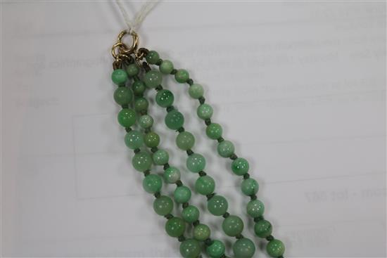 A double strand graduated jadeite bead necklace with carved jadeite pendant, pendant 29mm.